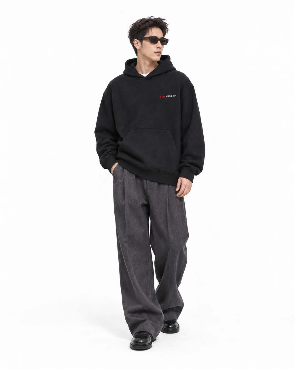 male model wearing Red Thread Character over Status hoodie in black