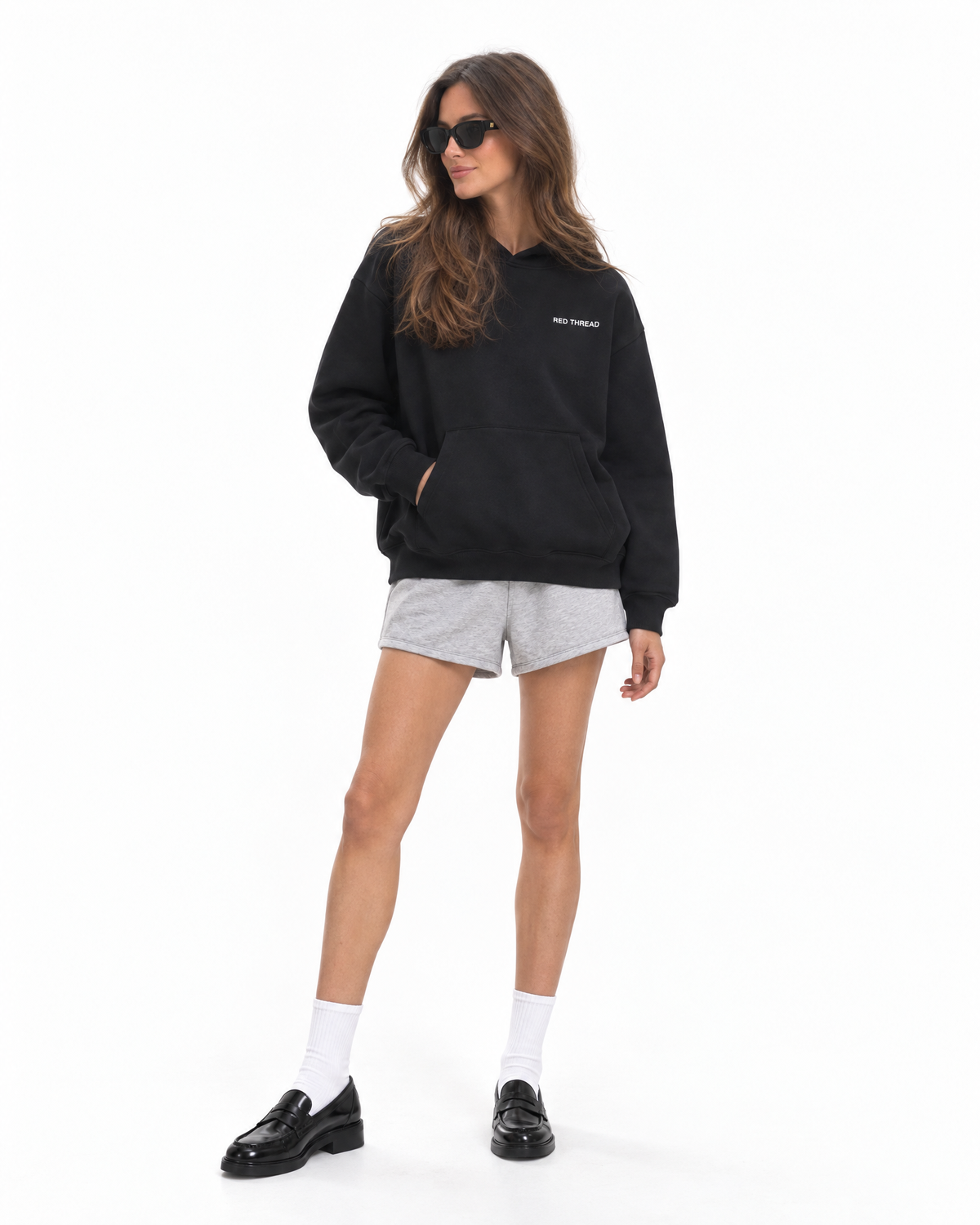 Red Thread Between Two Worlds hoodie in black, worn by a female model