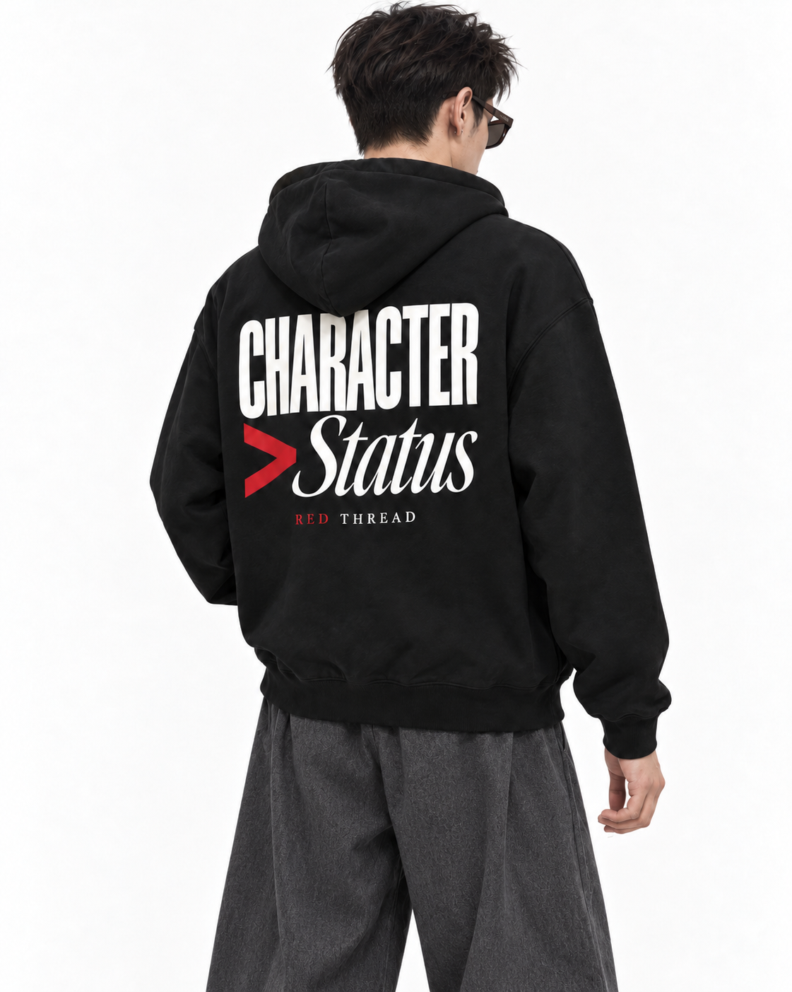 male model wearing Red Thread Character over Status hoodie in black