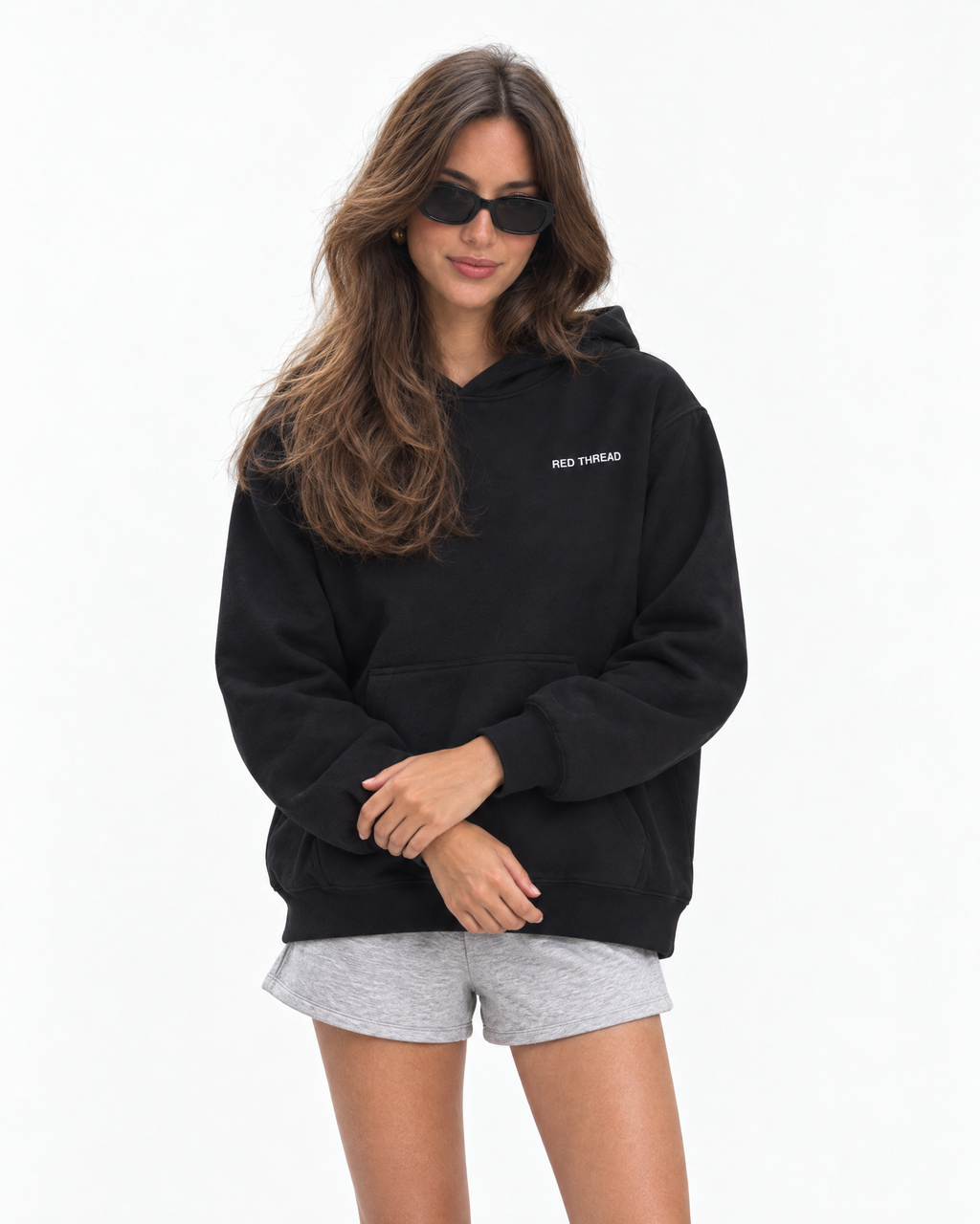 Red Thread Between Two Worlds hoodie in black, worn by a female model