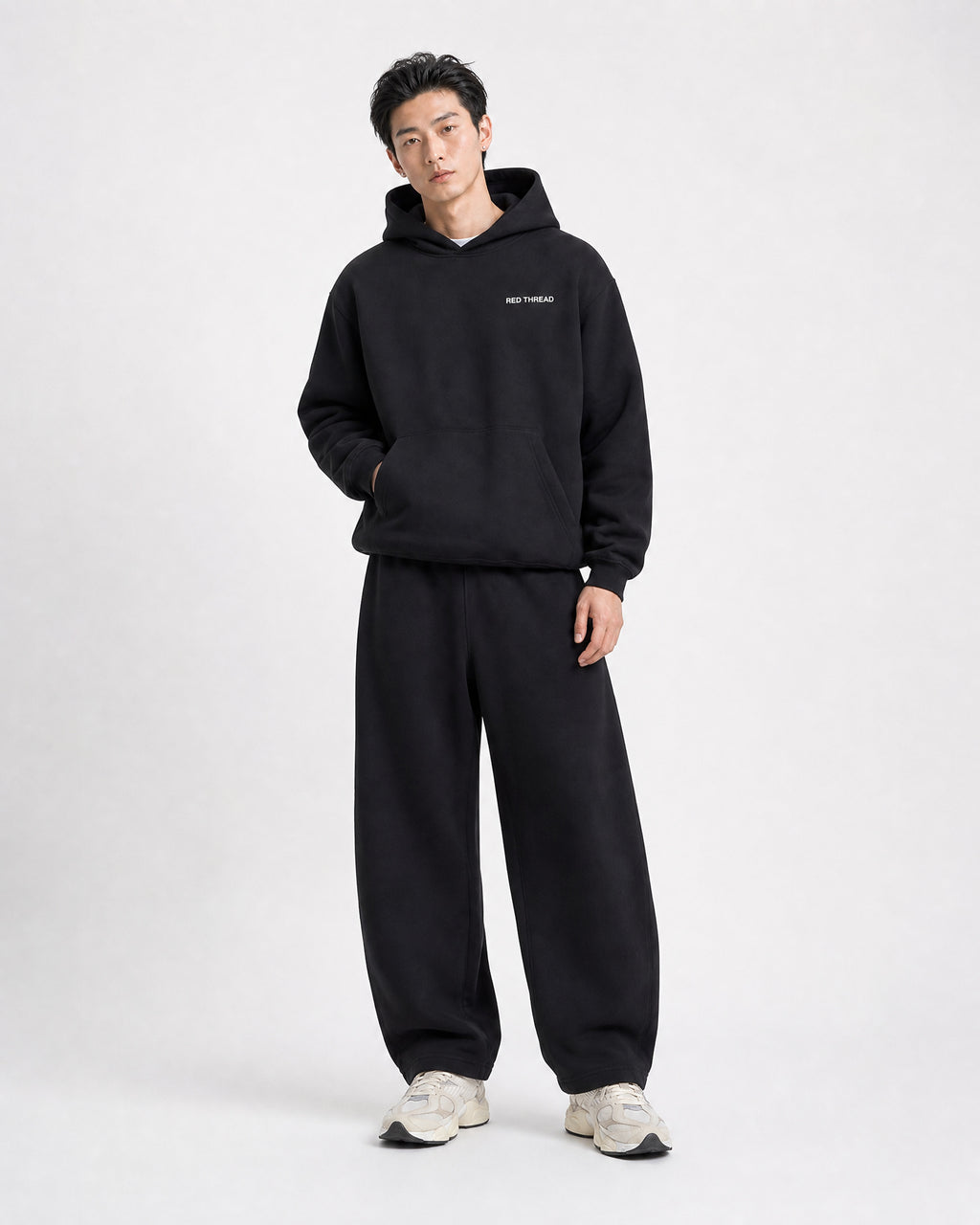 Red Thread Barrel sweatpants in black, worn by a model
