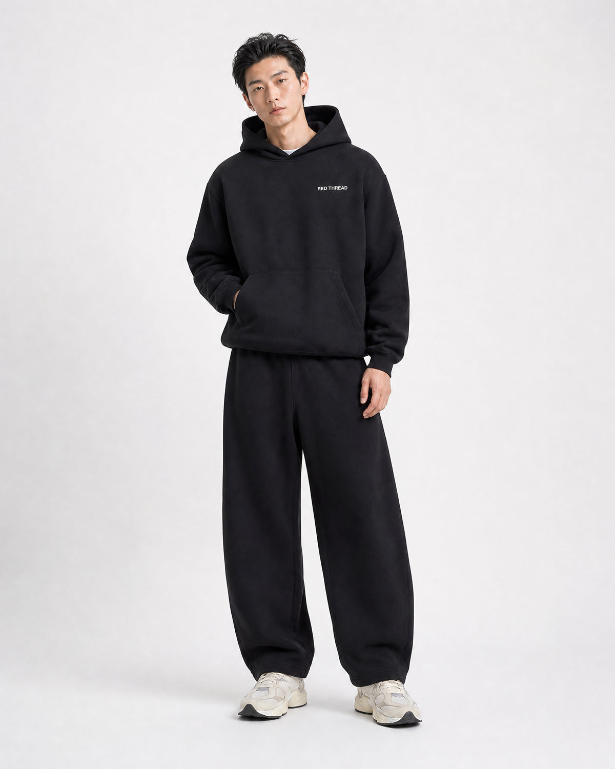 Red Thread Barrel sweatpants in black, worn by a model