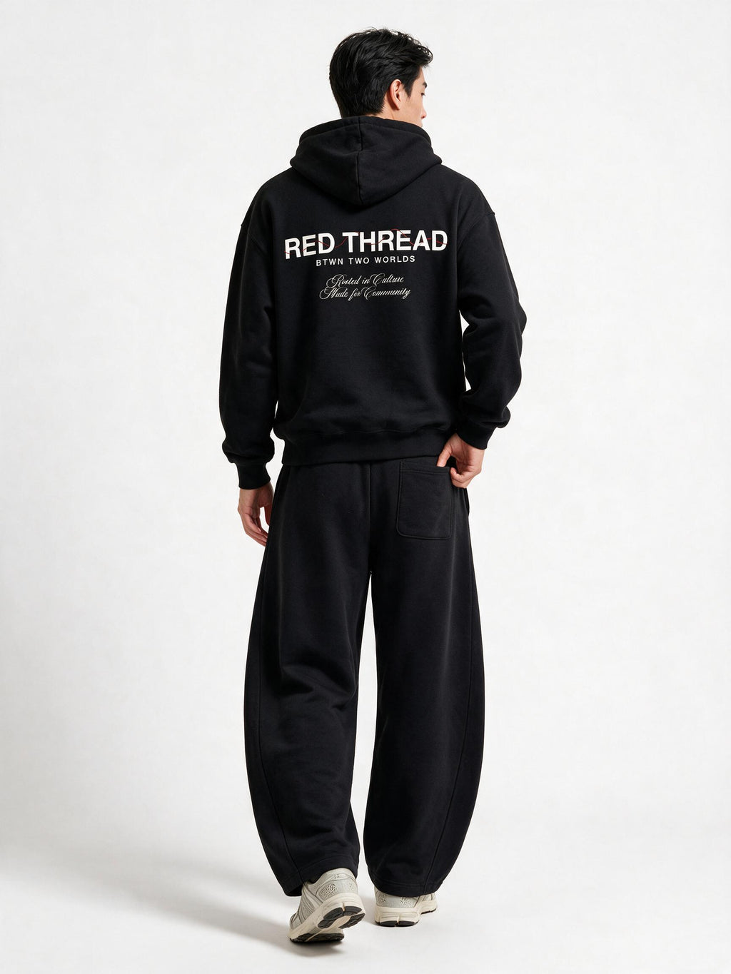 Red Thread Barrel sweatpants in black, worn by a model