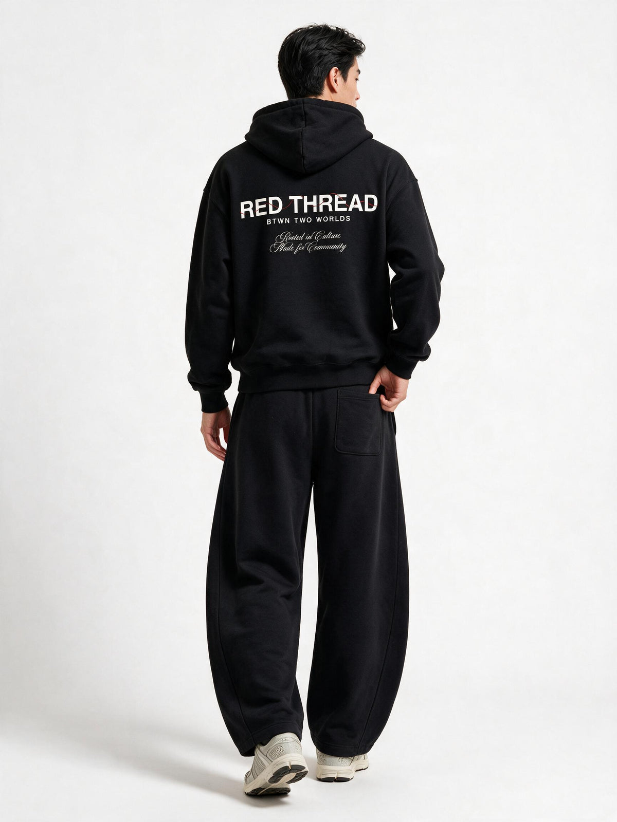 Red Thread Barrel sweatpants in black, worn by a model