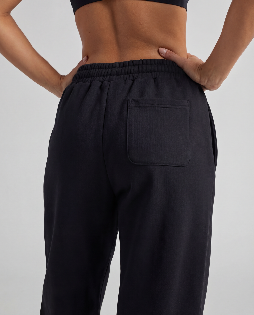 Red Thread Barrel sweatpants in black, worn by a model