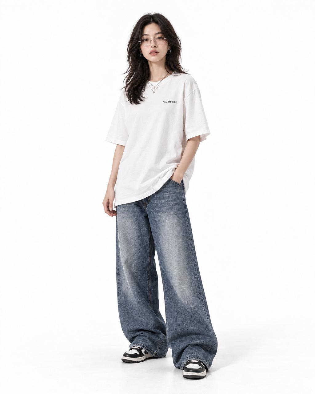 Red Thread Between Two Worlds heavyweight tee in white, worn by a female model