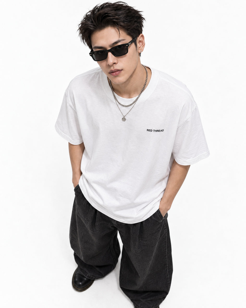 Red Thread Between Two Worlds heavyweight tee in white, worn by a male model