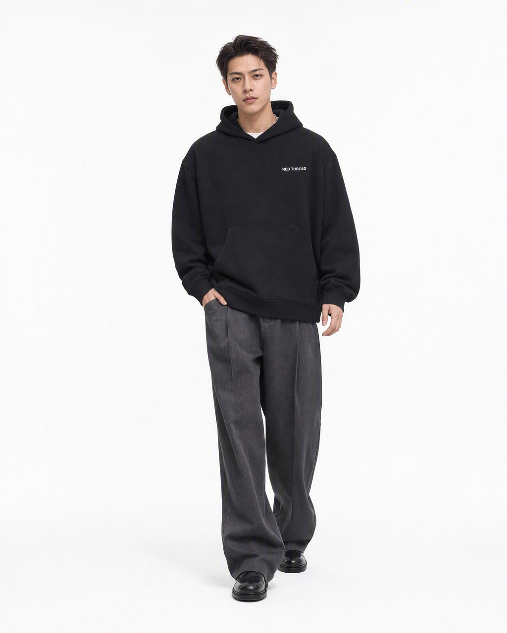 Red Thread Between Two Worlds hoodie in black, worn by a male model