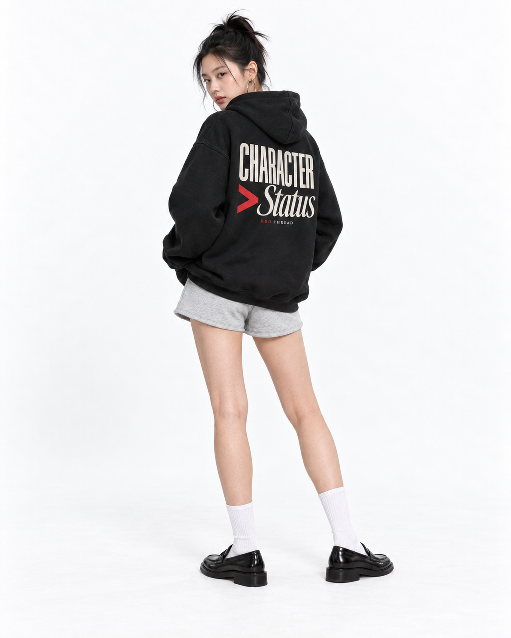 Female model wearing Red Thread Character over Status hoodie in black