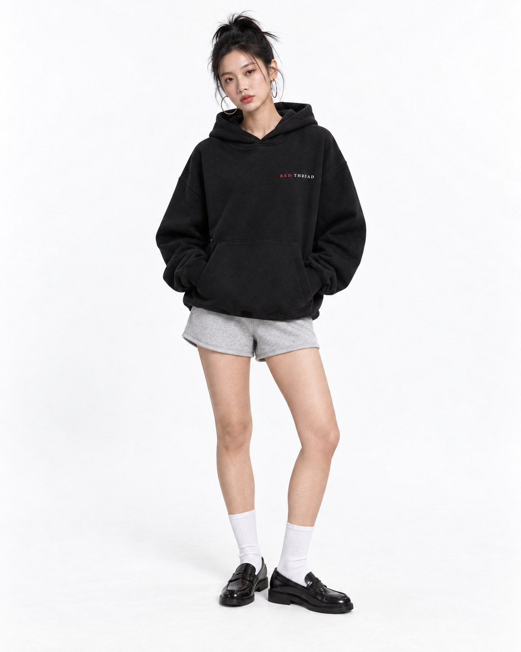 Female model wearing Red Thread Character over Status hoodie in black