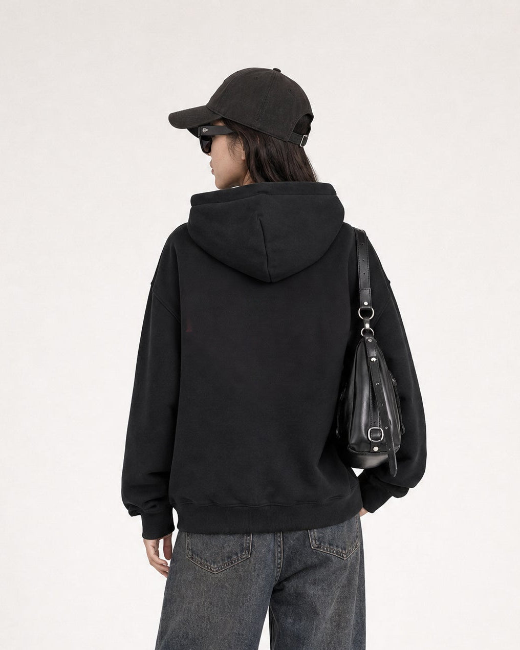 Red Thread Everyday hoodie in black, worn by a female model