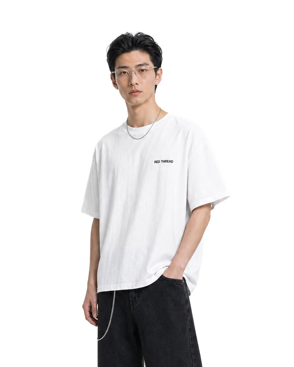Red Thread Raised Right heavyweight tee in white, worn by a male model