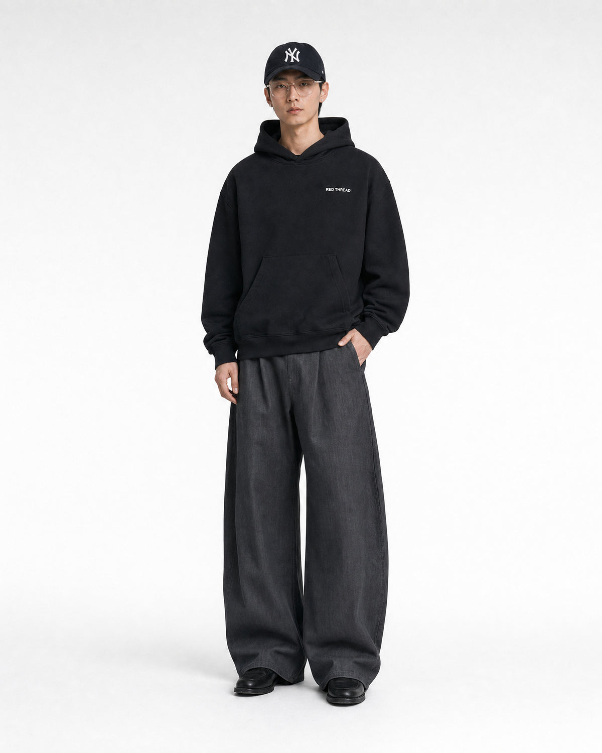 Red Thread Raised Right hoodie in black, worn by a male model