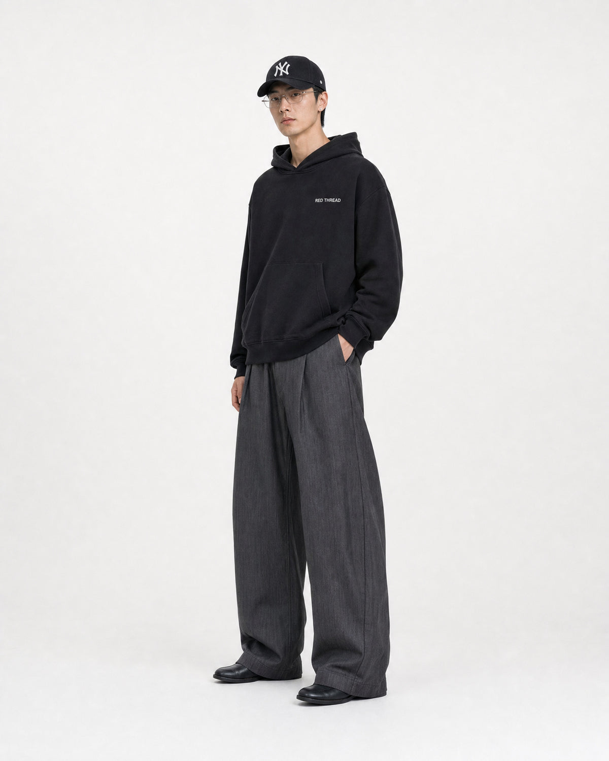 Red Thread Raised Right hoodie in black, worn by a male model