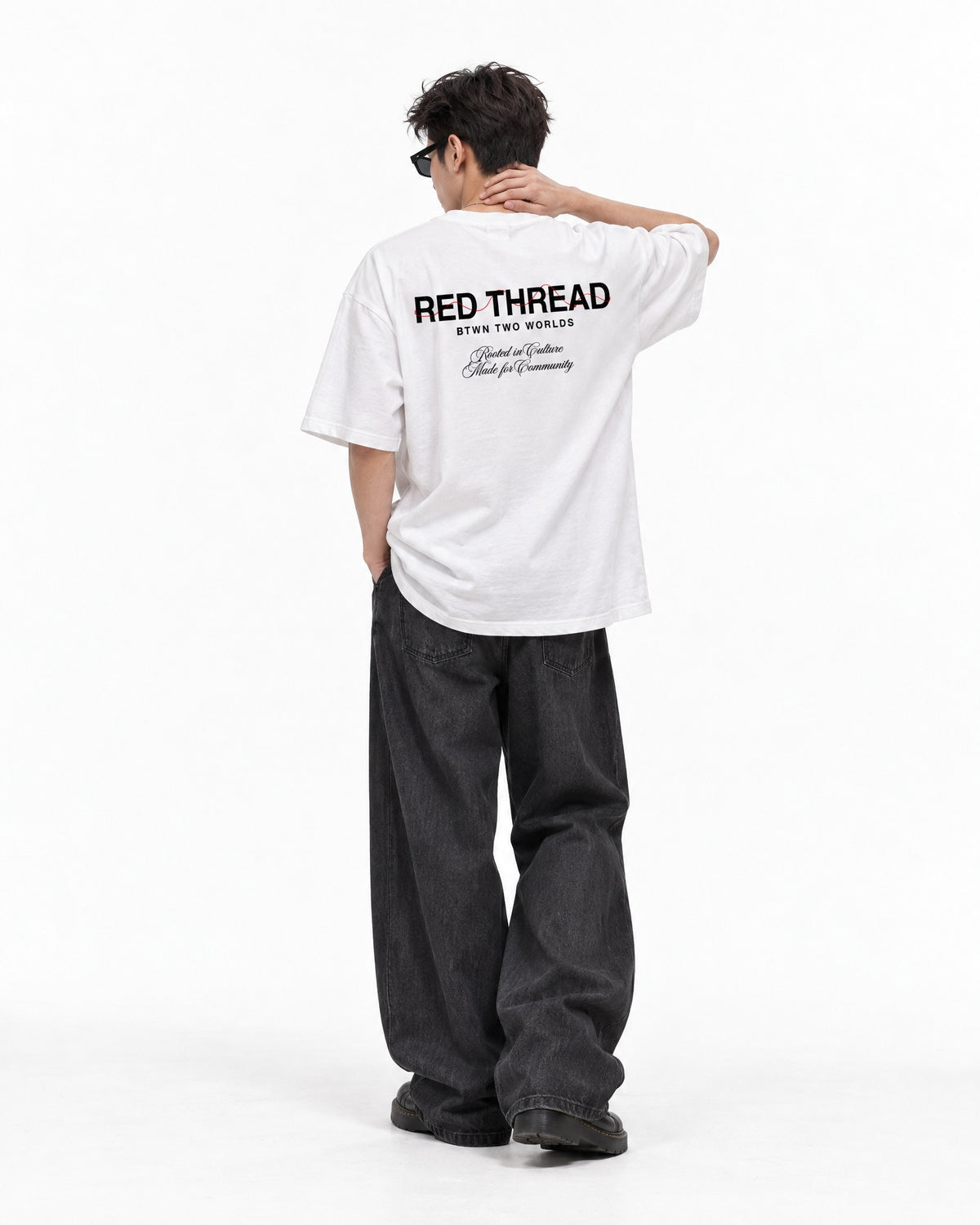 Red Thread Rooted In Culture heavyweight tee in white, worn by a male model