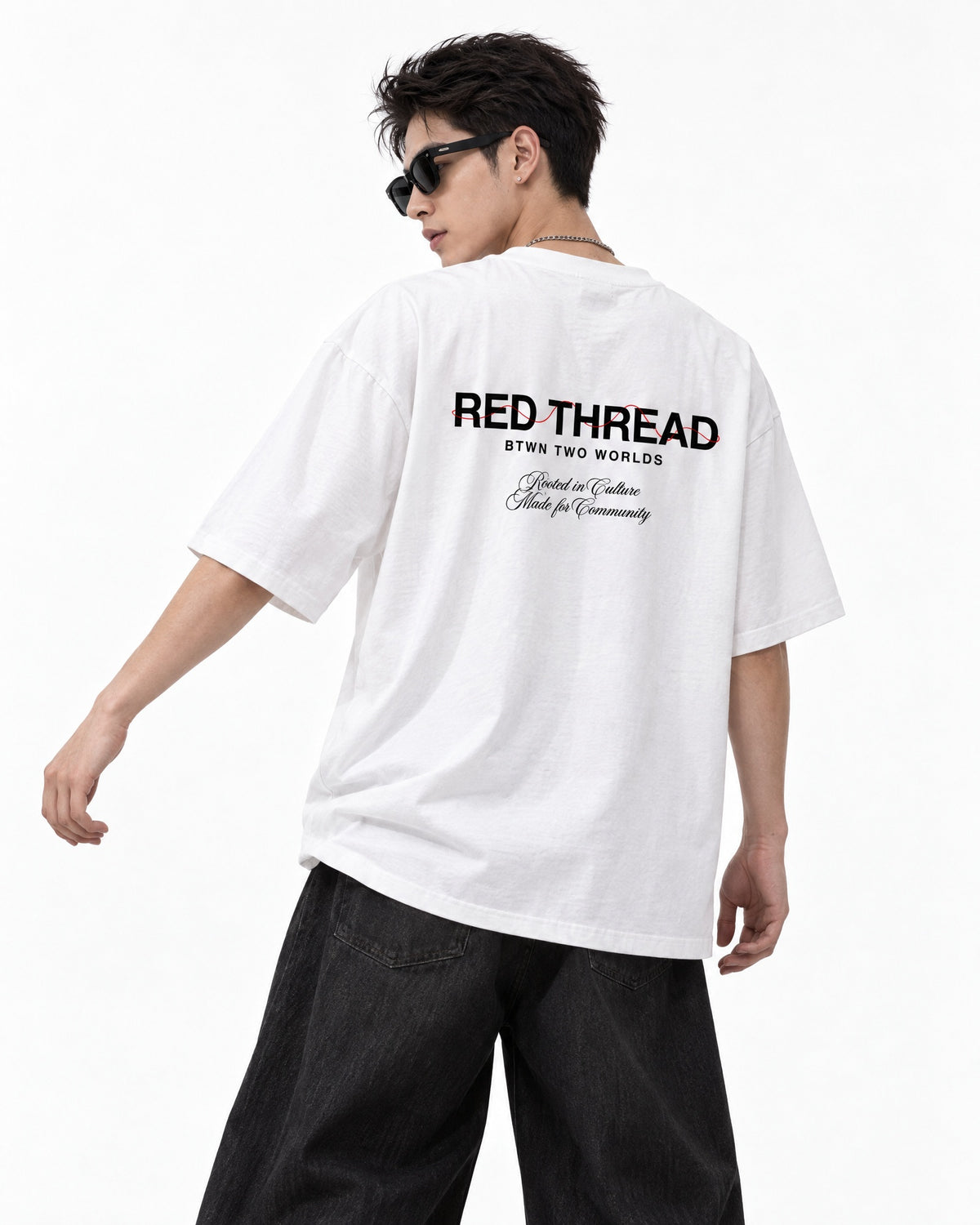 Red Thread Rooted In Culture heavyweight tee in white, worn by a male model