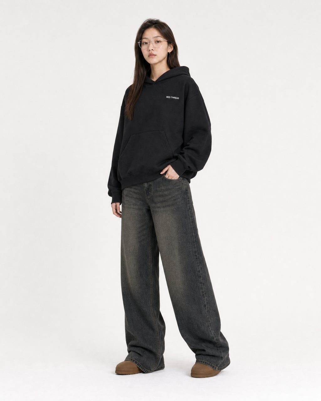 Red Thread Rooted In Culture hoodie in black, worn by a female model