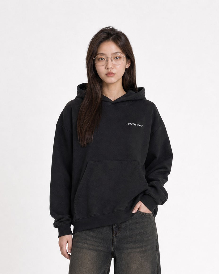 Red Thread Rooted In Culture hoodie in black, worn by a female model