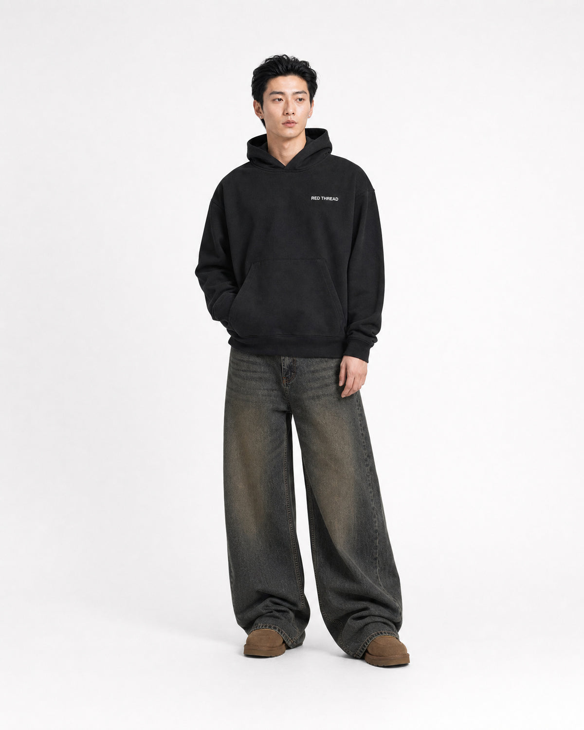 Red Thread Rooted In Culture hoodie in black, worn by a male model