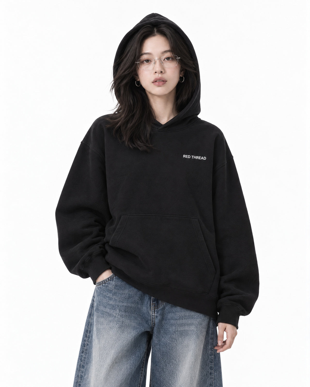 Red Thread Too East Too West hoodie in black, worn by a female model