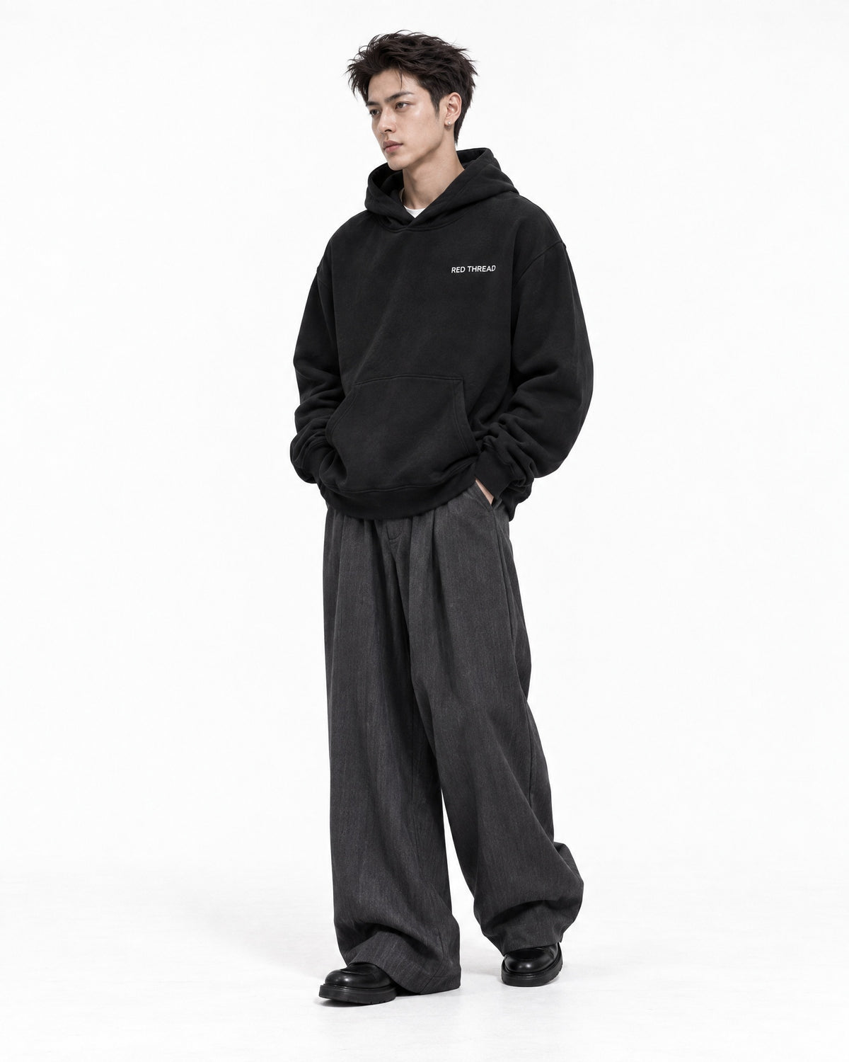 Red Thread Too East Too West hoodie in black, worn by a male model