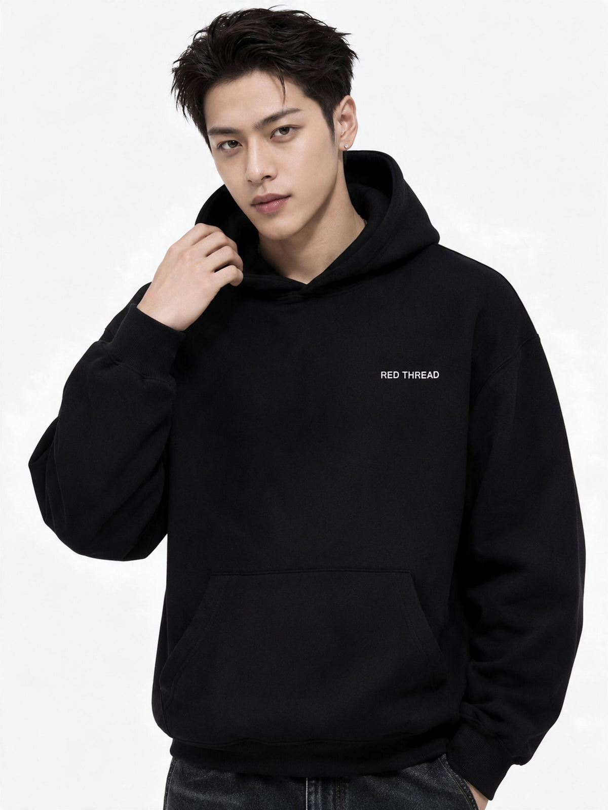 Red Thread Two Tone hoodie in black, worn by a male model