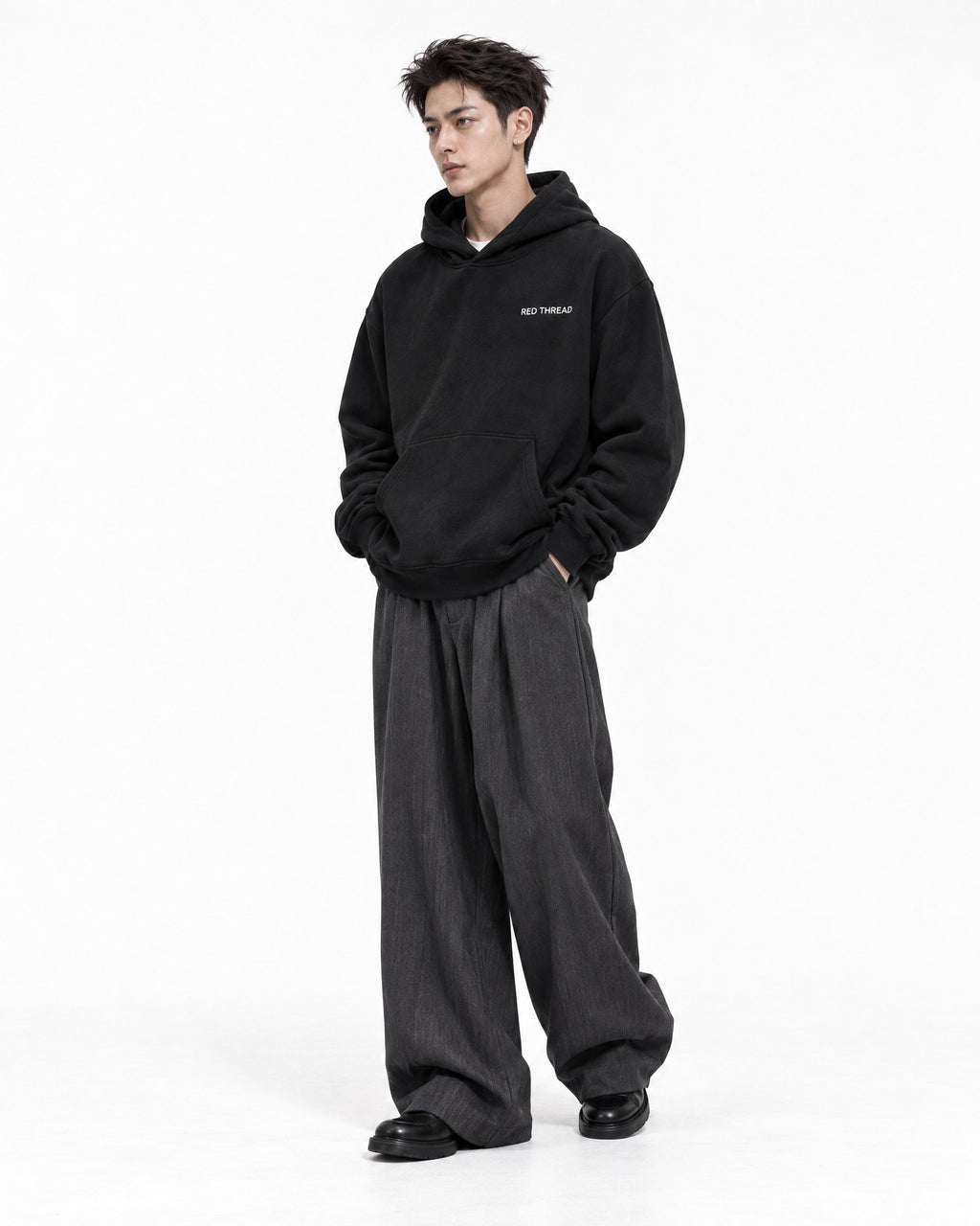 Red Thread Two Tone hoodie in black, worn by a male model