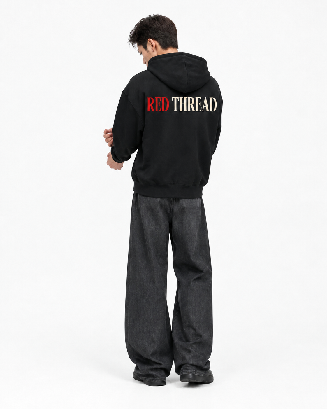 Red Thread Two Tone hoodie in black, worn by a male model